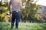 Standing in a field with wine