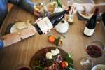 Passing a bottle of Sea View Ridge Pinot Noir